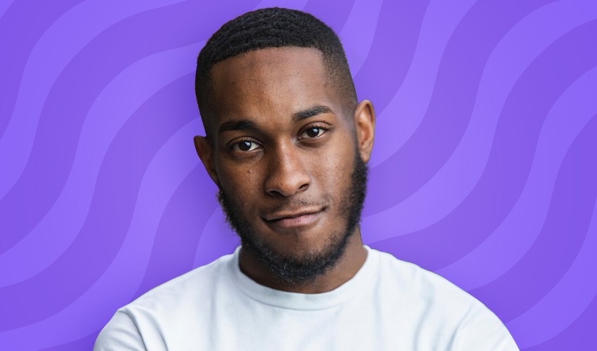A photo of Kian Hunt in front of a purple swirl background.