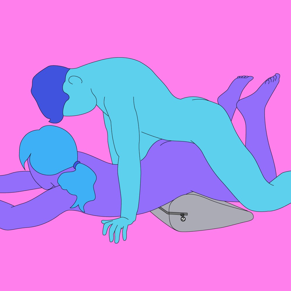 A naked illustrated couple. One is lying down with a sex wedge under their hips and the other is straddling them from behind.