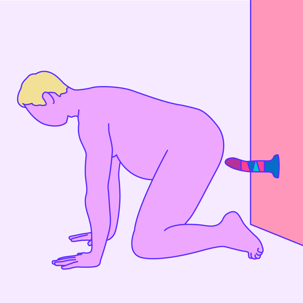 A naked illustrated person on their hands and knees, with a suction-cup dildo on the wall behind them.