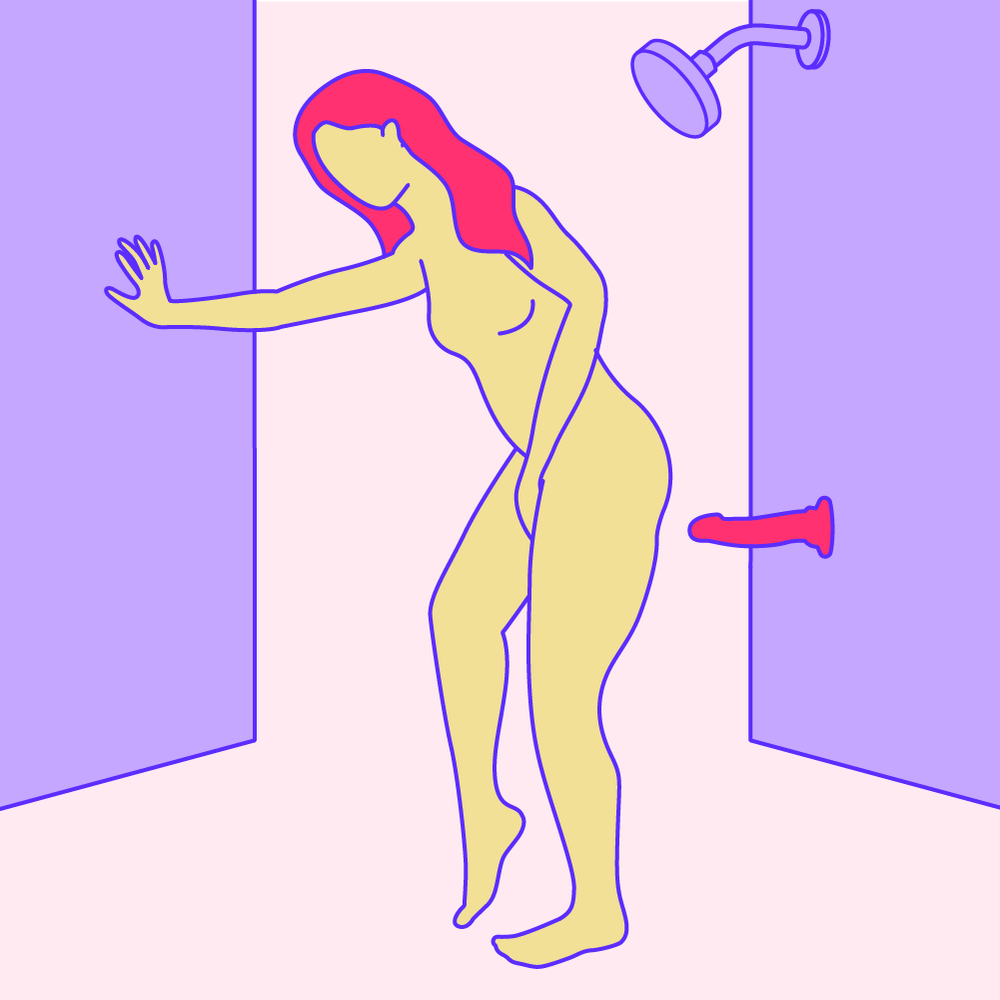 A naked illustrated woman touching herself in the shower, with a suction cup dildo on the wall behind her.