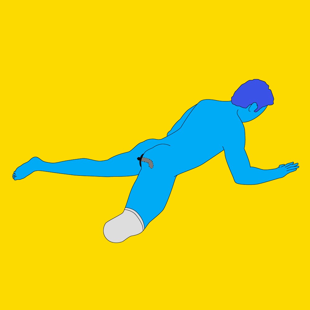 A naked illustrated man lying face-down on the floor, with their arms propped up and their legs open.