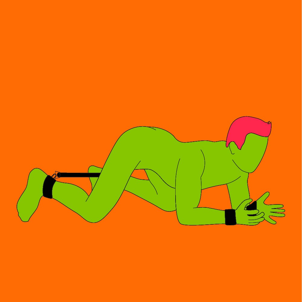 A naked illustrated man led on the floor with their back arched. They are wearing wrist cuffs and a leg stretcher on their ankles.